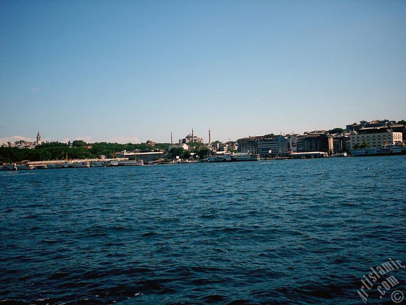 View of Eminonu coast, Ayasofya Mosque (Hagia Sophia) and Topkapi Palace from the shore of Karakoy in Istanbul city of Turkey.
