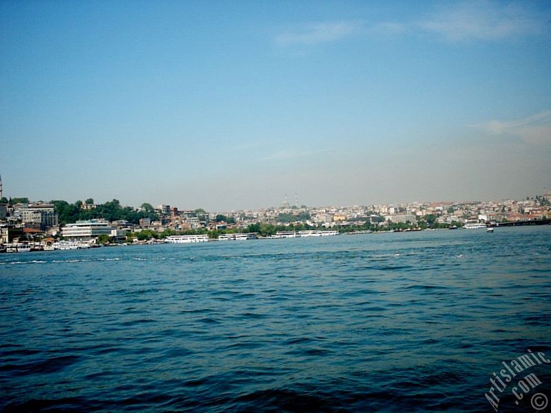 View of Eminonu-Sarachane coast, on the horizon in the middle Fatih Mosque and on the right Yavuz Sultan Selim Mosque from Galata Bridge located in Istanbul city of Turkey.
