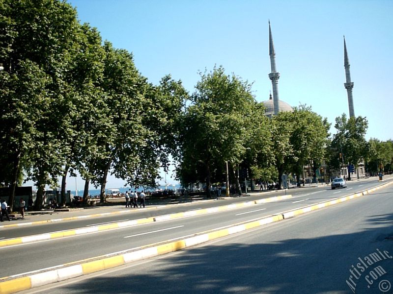 View of Dolmabahce coast and Valide Sultan Mosque in Dolmabahce district in Istanbul city of Turkey.
