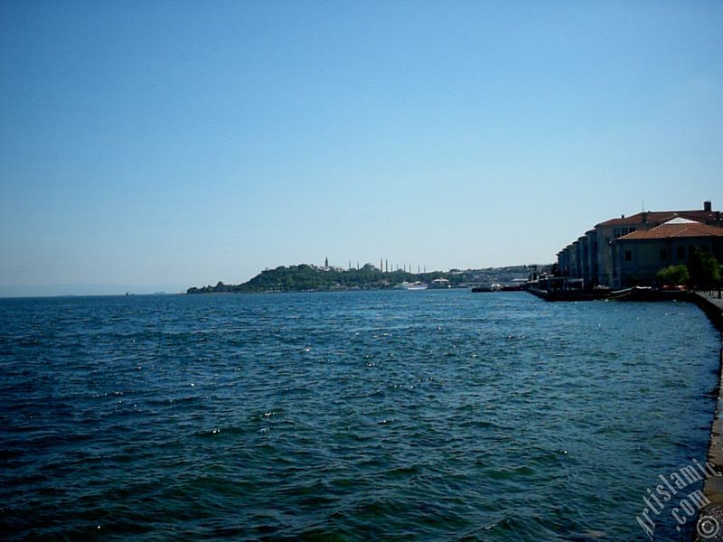 View towards Sarayburnu coast, Topkapi Palace, Ayasofya Mosque (Hagia Sophia) and  Sultan Ahmet Mosque (Blue Mosque) from a park at Kabatas shore in Istanbul city of Turkey.
