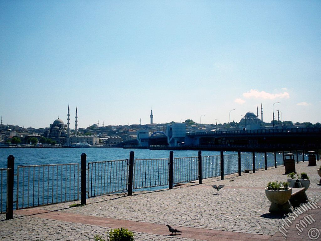 View of (from left) Yeni Cami (Mosque), (at far behind) Beyazit Mosque, Beyazit Tower, Galata Brigde and Suleymaniye Mosque from the shore of Karakoy in Istanbul city of Turkey.
